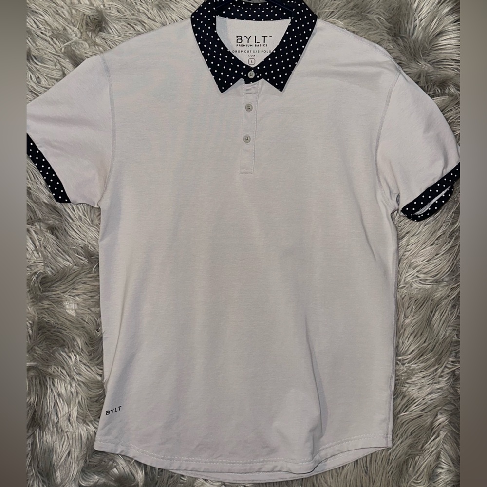 Men’s BYLT polo (lux collection) dotted cuffs/collar.
Size L